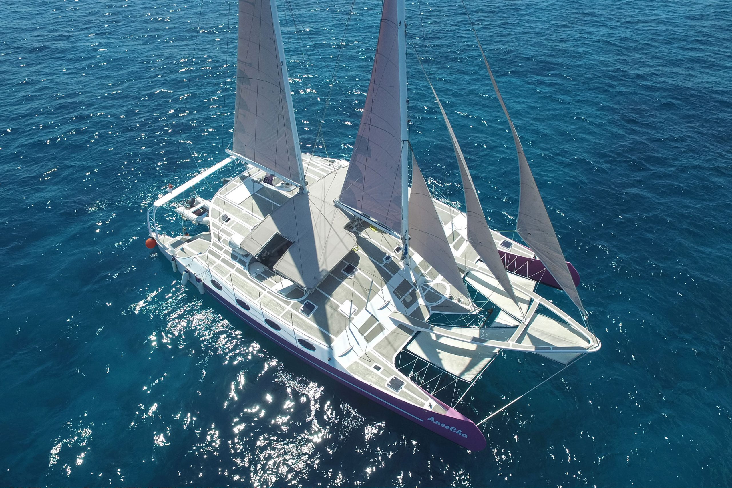 Drone view of the yacht anchored near a Bali island