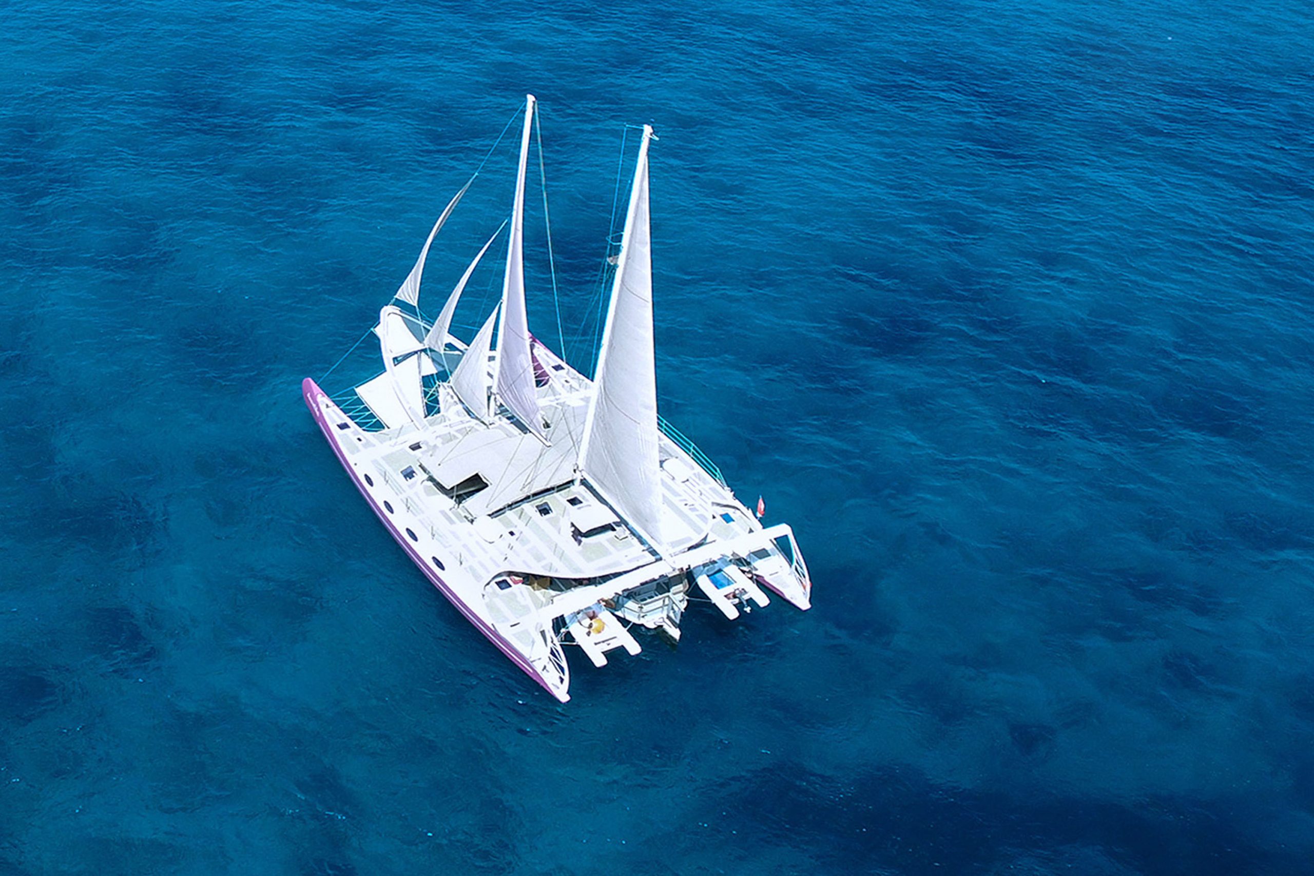 Aerial view of the private charter yacht cruising Bali waters