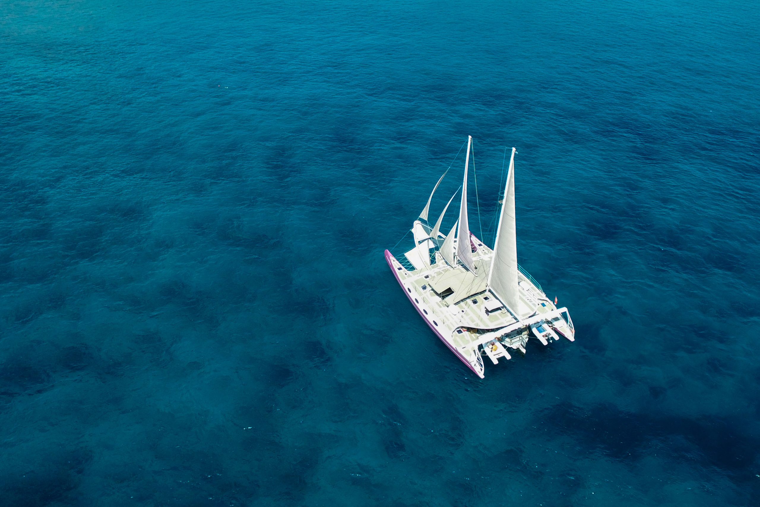 Aerial profile of the catamaran-style charter yacht