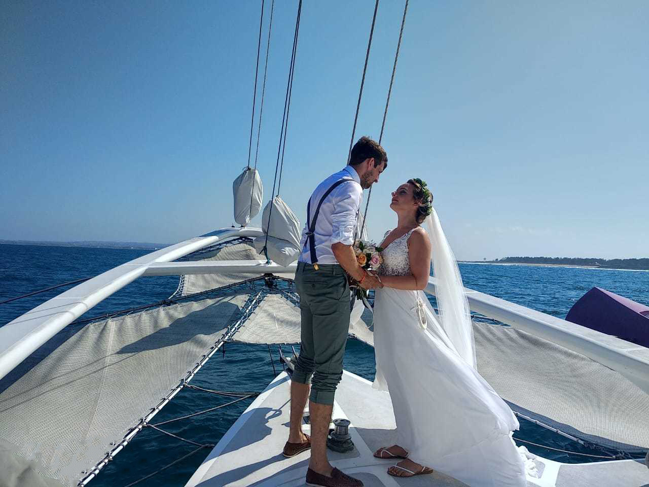 Wedding celebration on deck at golden hour